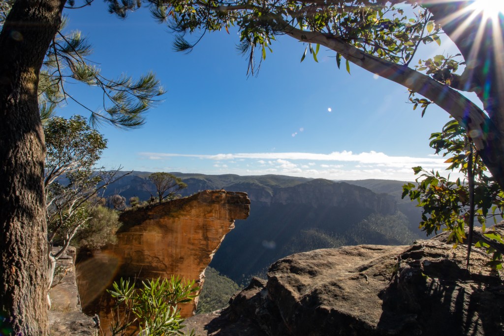 View on Hanging rock framed by two trees